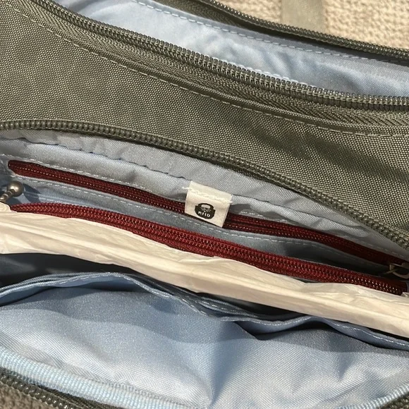 Baggallini. Brand new with tags. Grey with subtle cheetah print background. - Picture 10 of 12